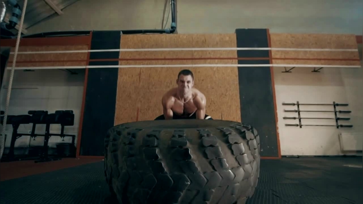 mixkit-muscular-man-doing-crossfit-exercises-with-tire-23266-medium